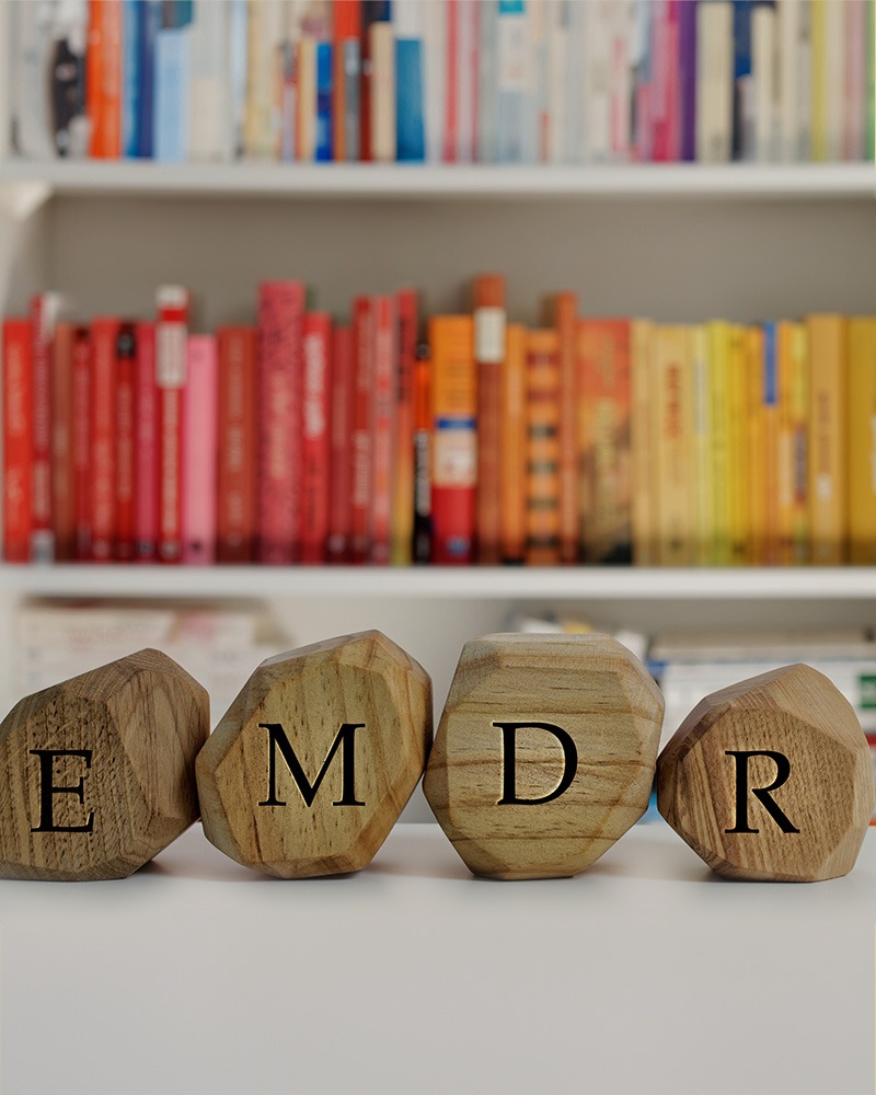 EMDR therapy blocks in front of colorful bookcase